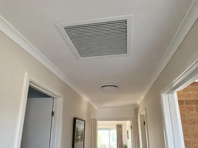 Ceiling return-air grille in a hallway with white trim and nearby rooms in Modbury Heights